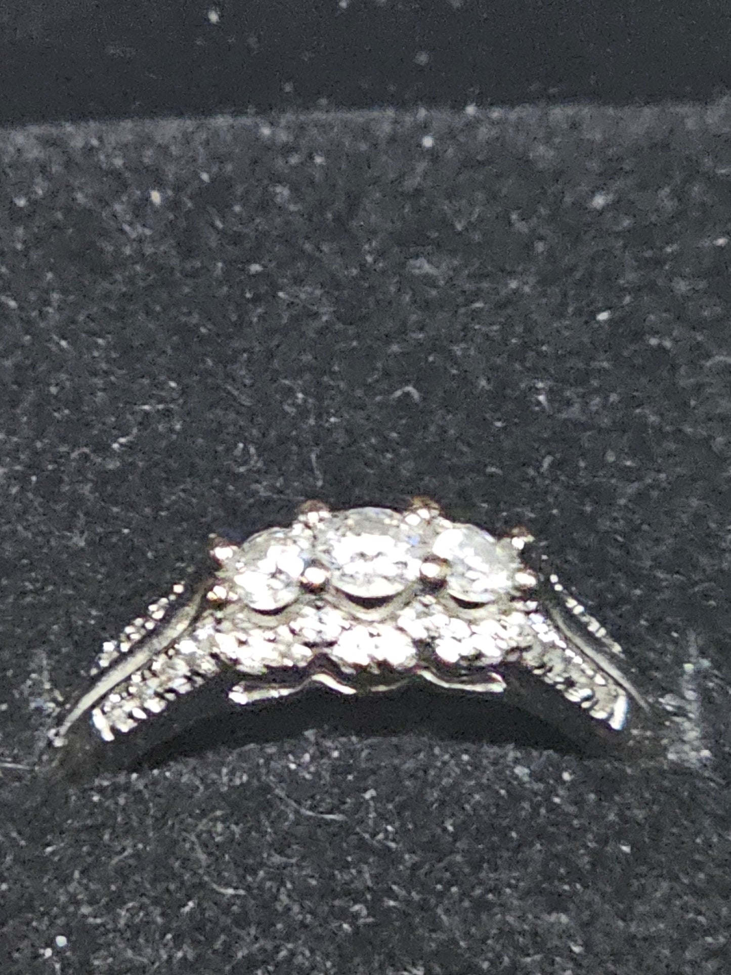 Three stone 10kt white gold diamond ring