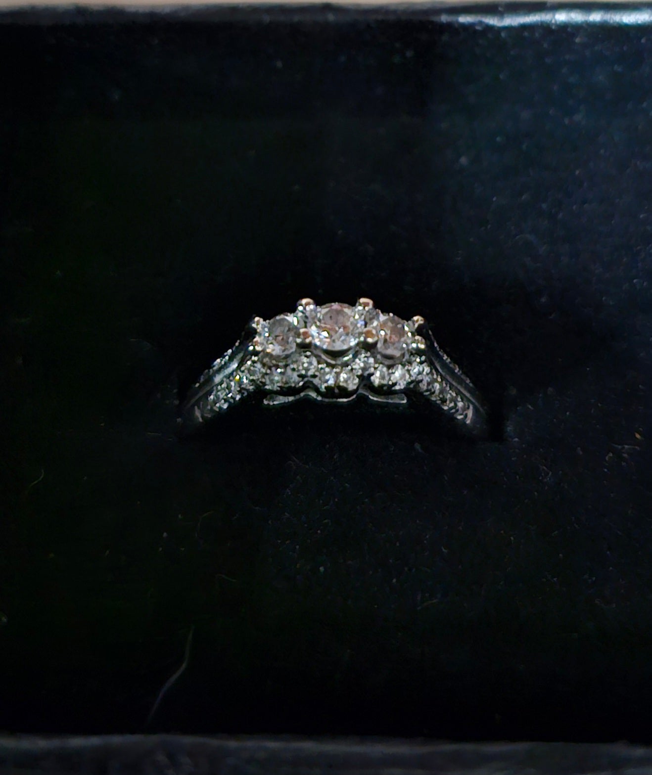 Three stone 10kt white gold diamond ring