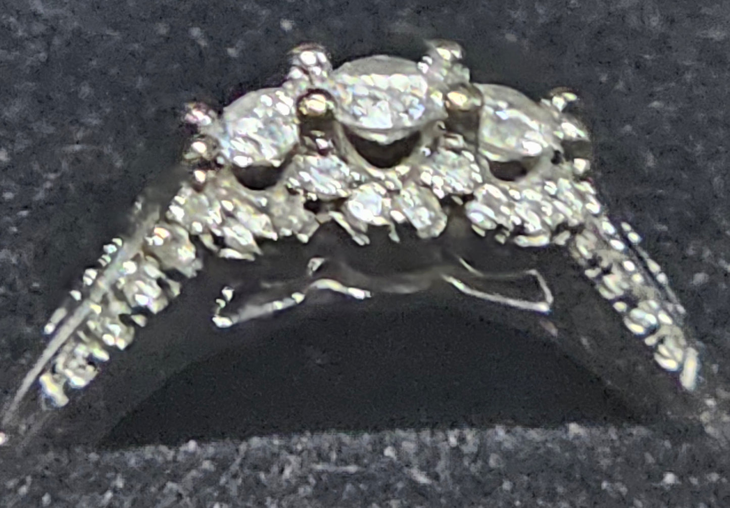 Three stone 10kt white gold diamond ring